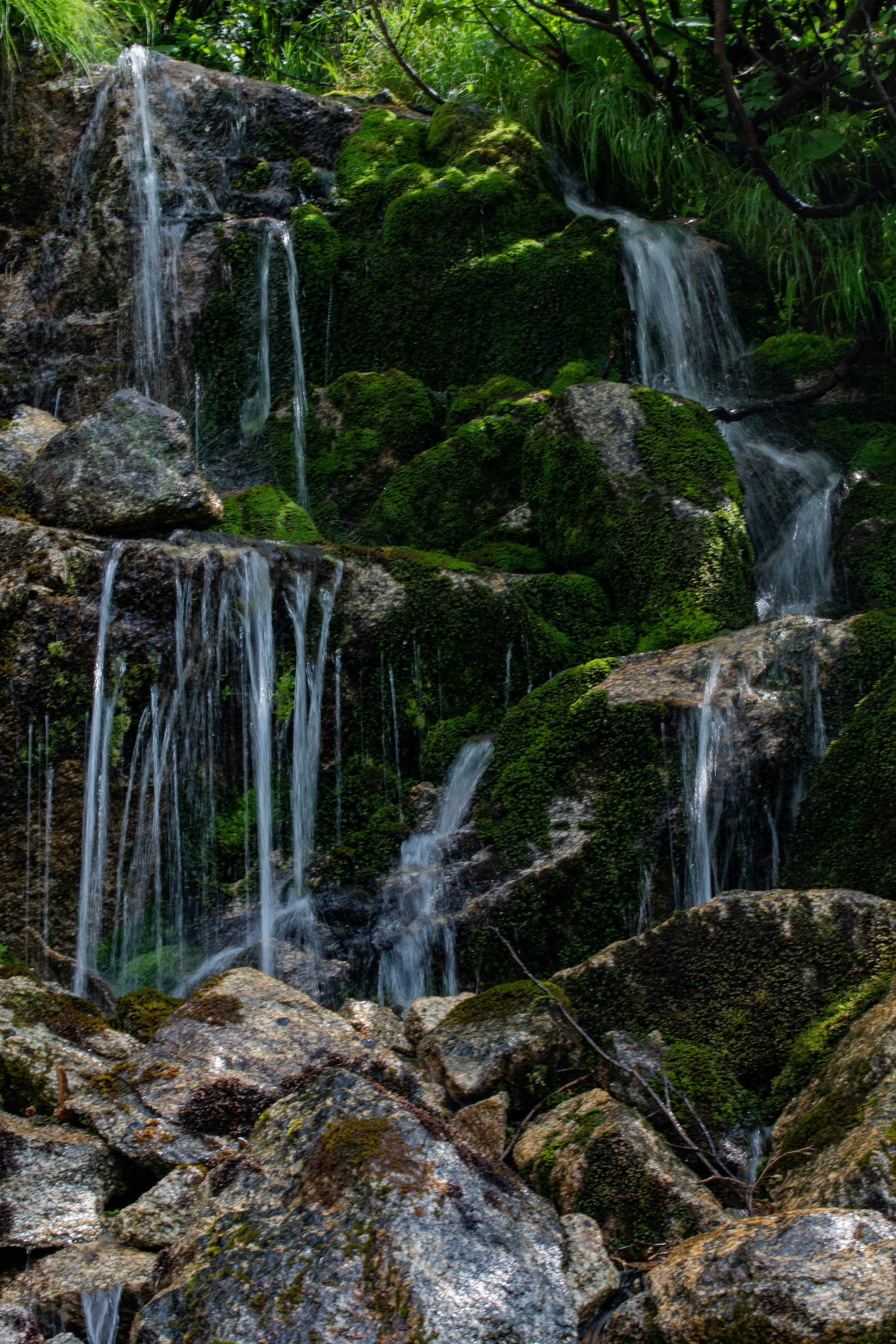 water falls on rocky mountain